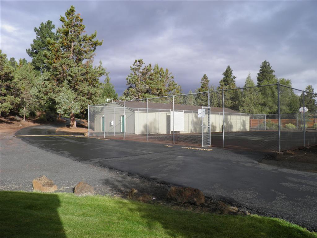 1700 Northeast Wells Acres Road, Unit 15 Bend, OR 97701 - Photo 16 of 17 Storage buildings and fenced play area