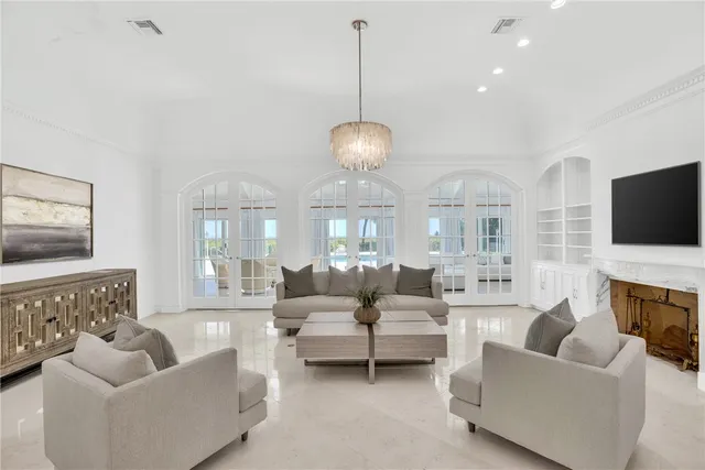 a living room with furniture fireplace and flat screen tv