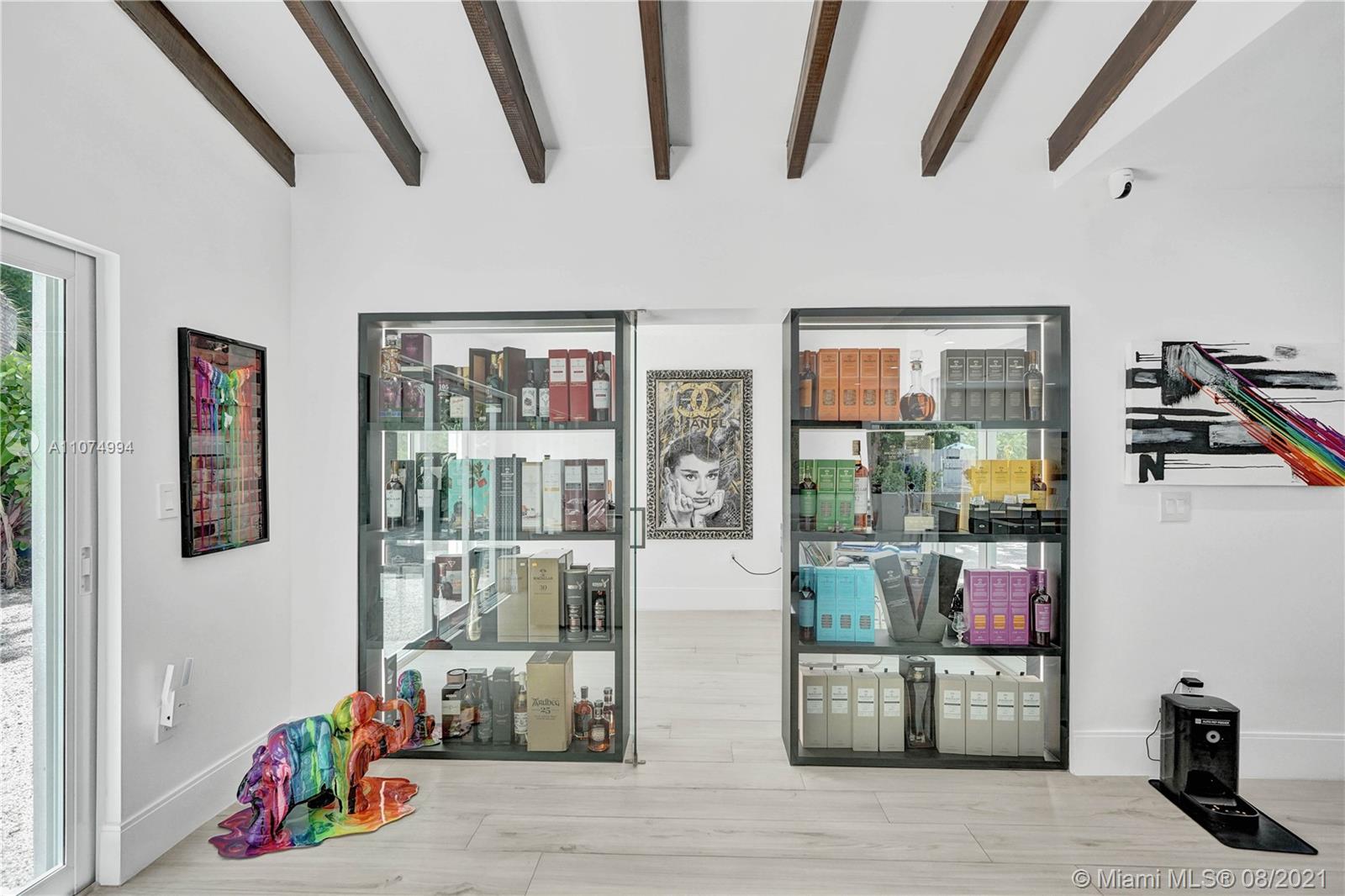 3570 Main Highway Miami, FL 33133 - Photo 16 of 76 a living room with furniture and wooden floor