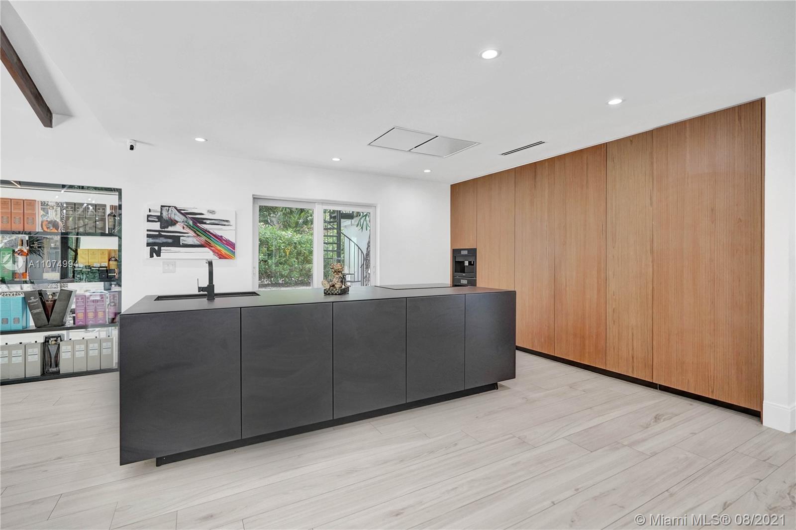 3570 Main Highway Miami, FL 33133 - Photo 20 of 76 a living room with furniture window and flat screen tv