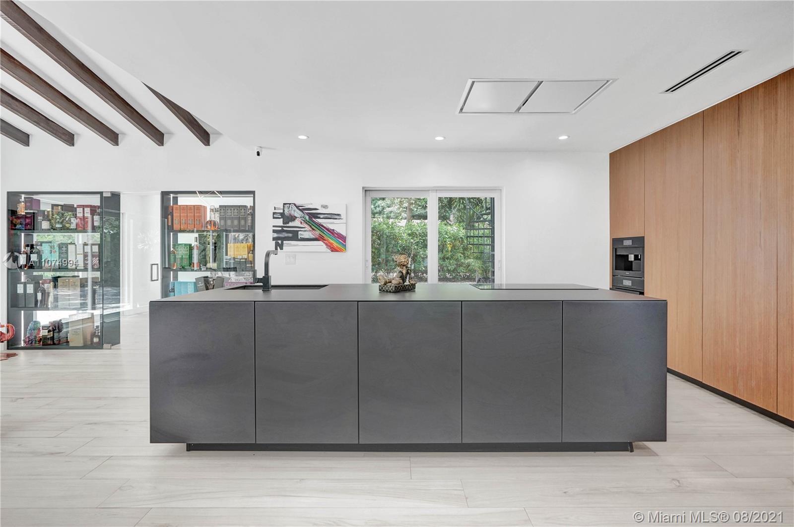 3570 Main Highway Miami, FL 33133 - Photo 22 of 76 a living room with furniture and windows