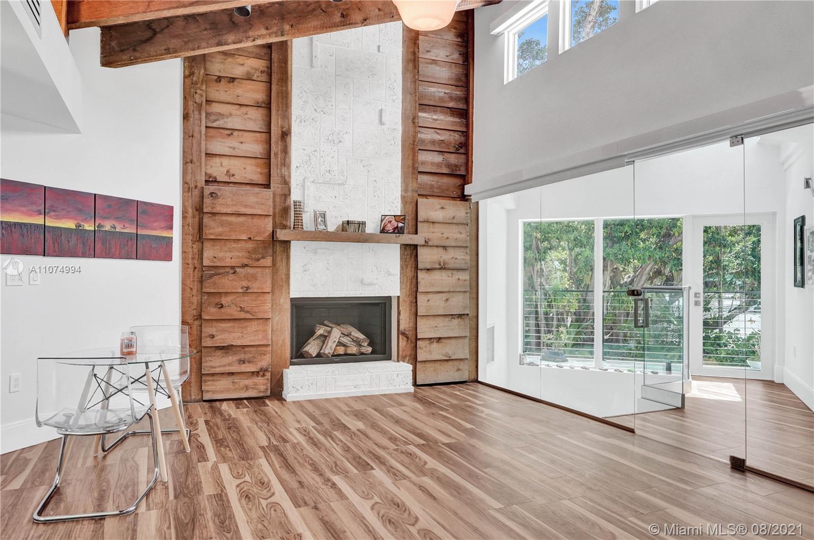 3570 Main Highway Miami, FL 33133 - Photo 33 of 76 a view of livingroom with furniture and fireplace