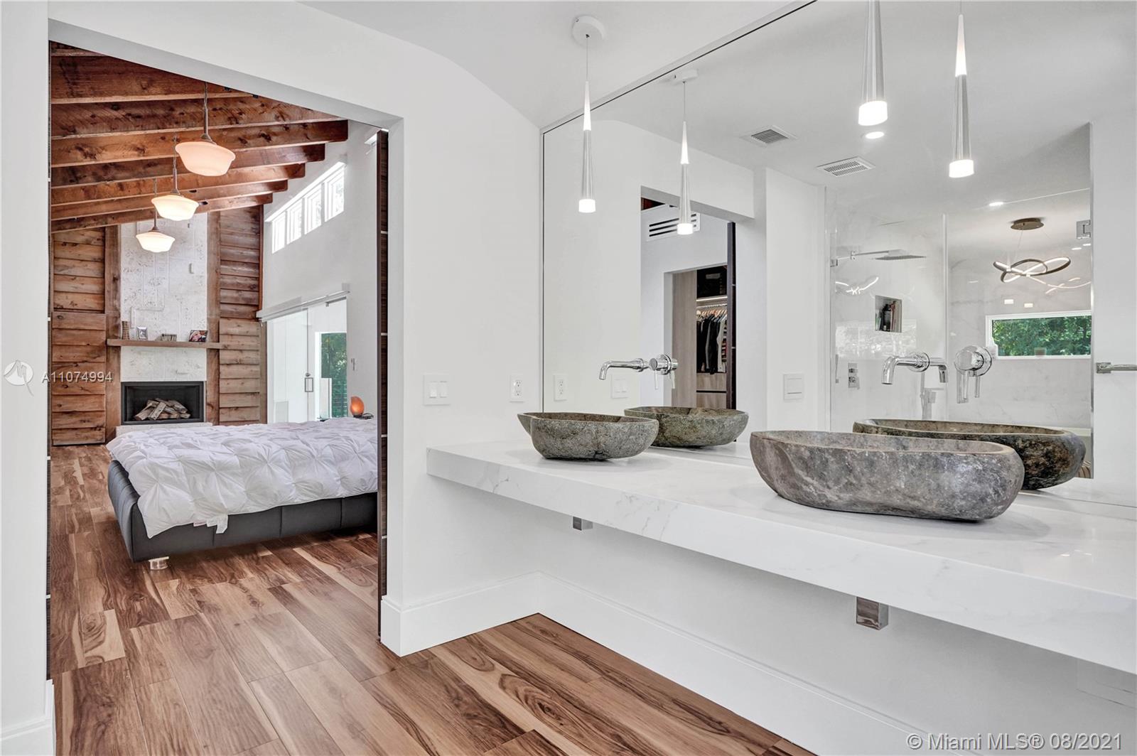 3570 Main Highway Miami, FL 33133 - Photo 39 of 76 a living room with furniture and a wooden floor