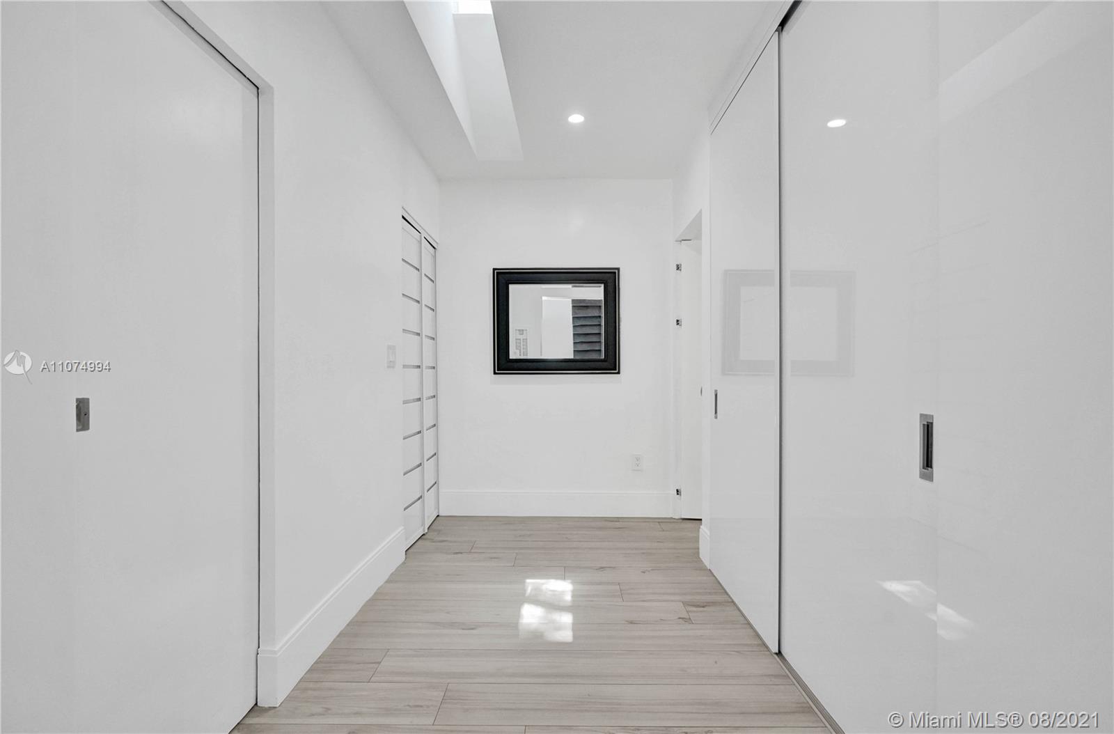 3570 Main Highway Miami, FL 33133 - Photo 46 of 76 a view of a hallway with wooden floor