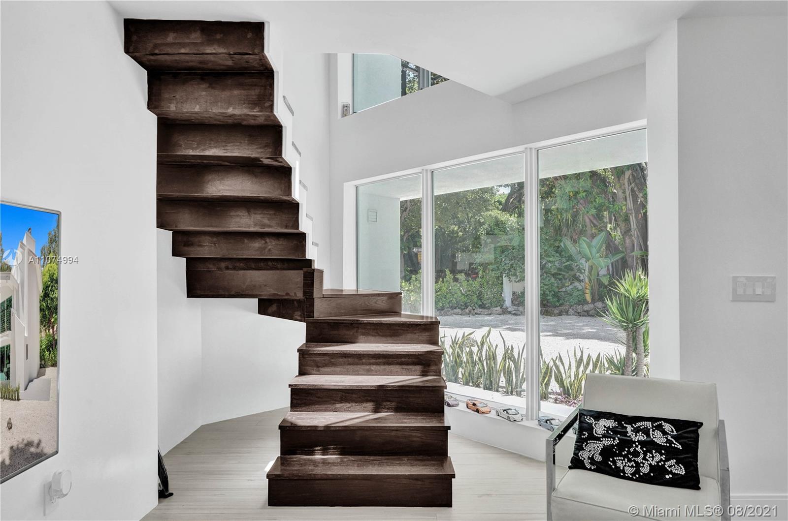 3570 Main Highway Miami, FL 33133 - Photo 50 of 76 a view of entryway and hall with wooden floor