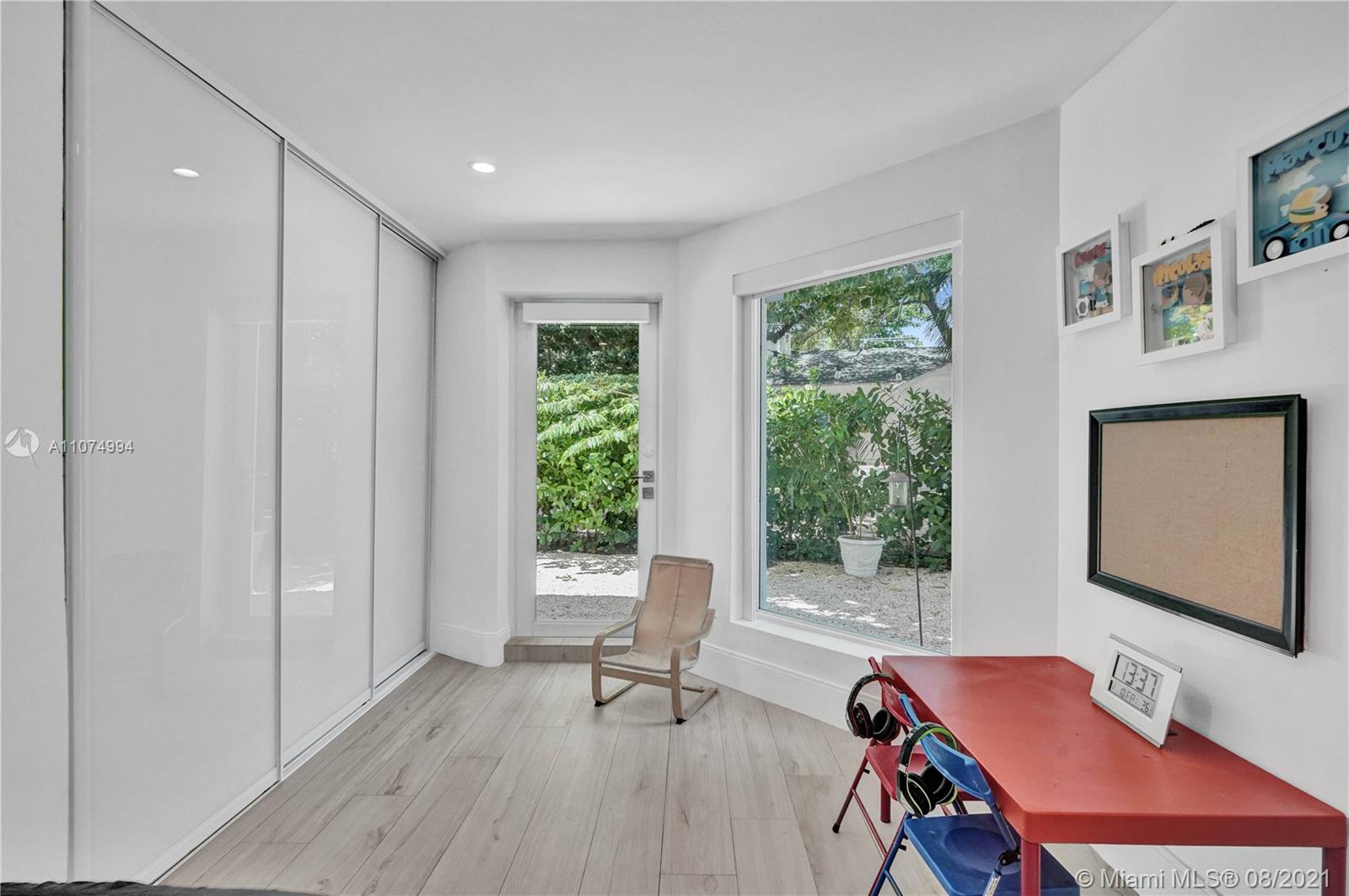 3570 Main Highway Miami, FL 33133 - Photo 55 of 76 a workspace with furniture and a window