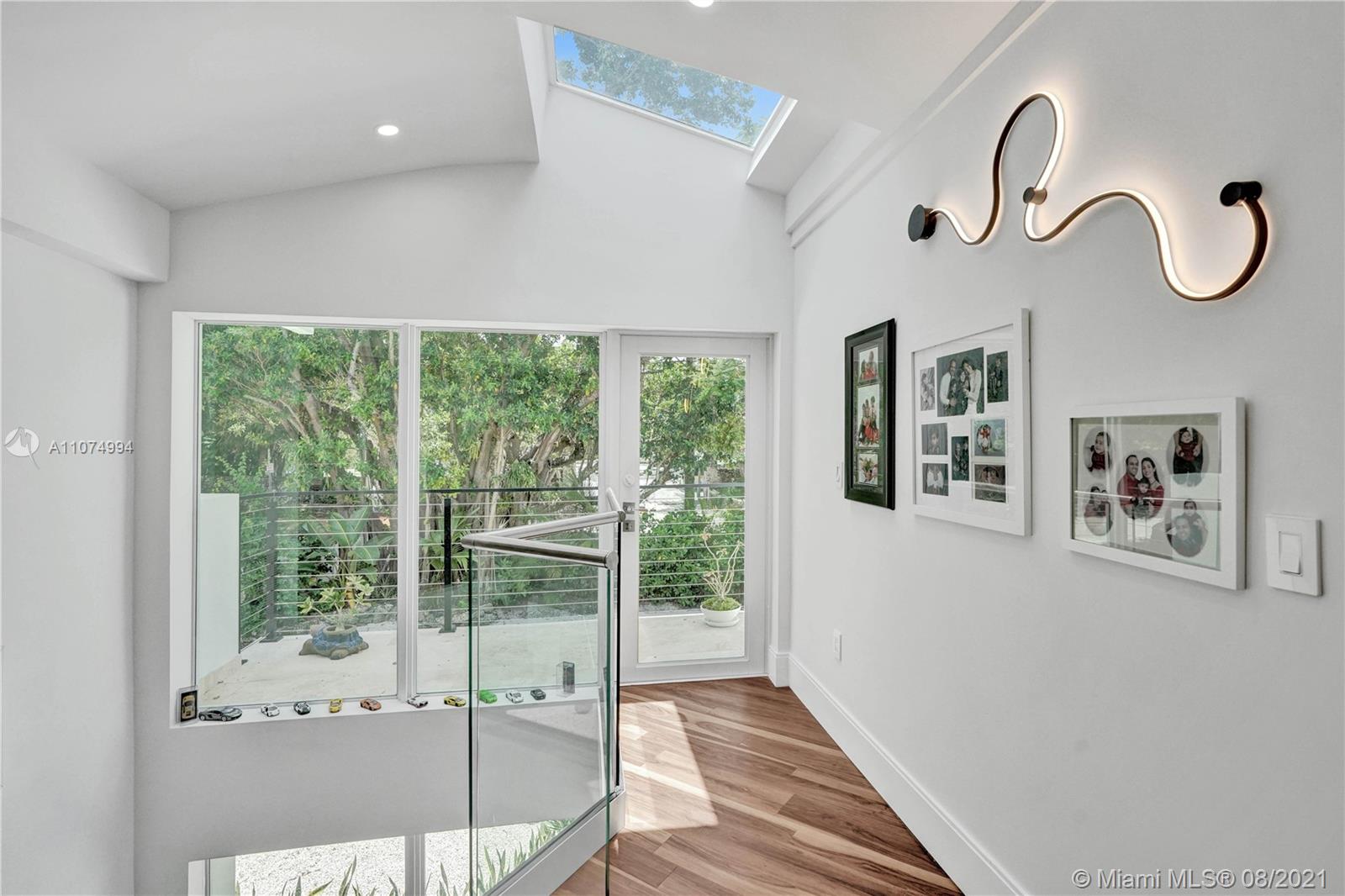 3570 Main Highway Miami, FL 33133 - Photo 57 of 76 a floor to ceiling window and a rug