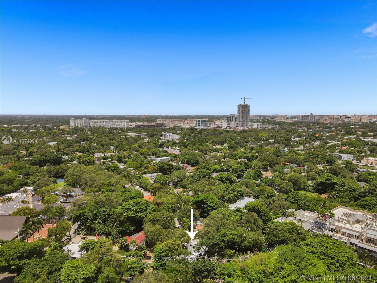 3570 Main Highway Miami, FL 33133 - Photo 74 of 76 an aerial view of residential houses with outdoor space and trees