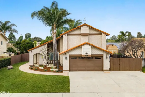 a front view of a house with yard