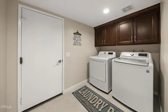 a view of storage and utility room with washer and dryer