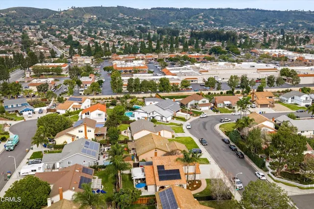 a view of a town with mountains in the background