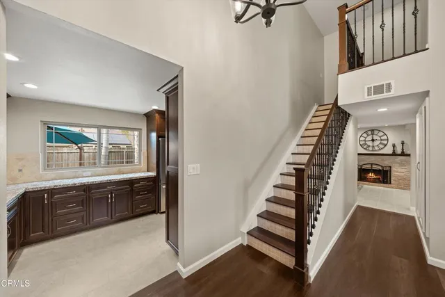 a view of a kitchen with furniture and staircase