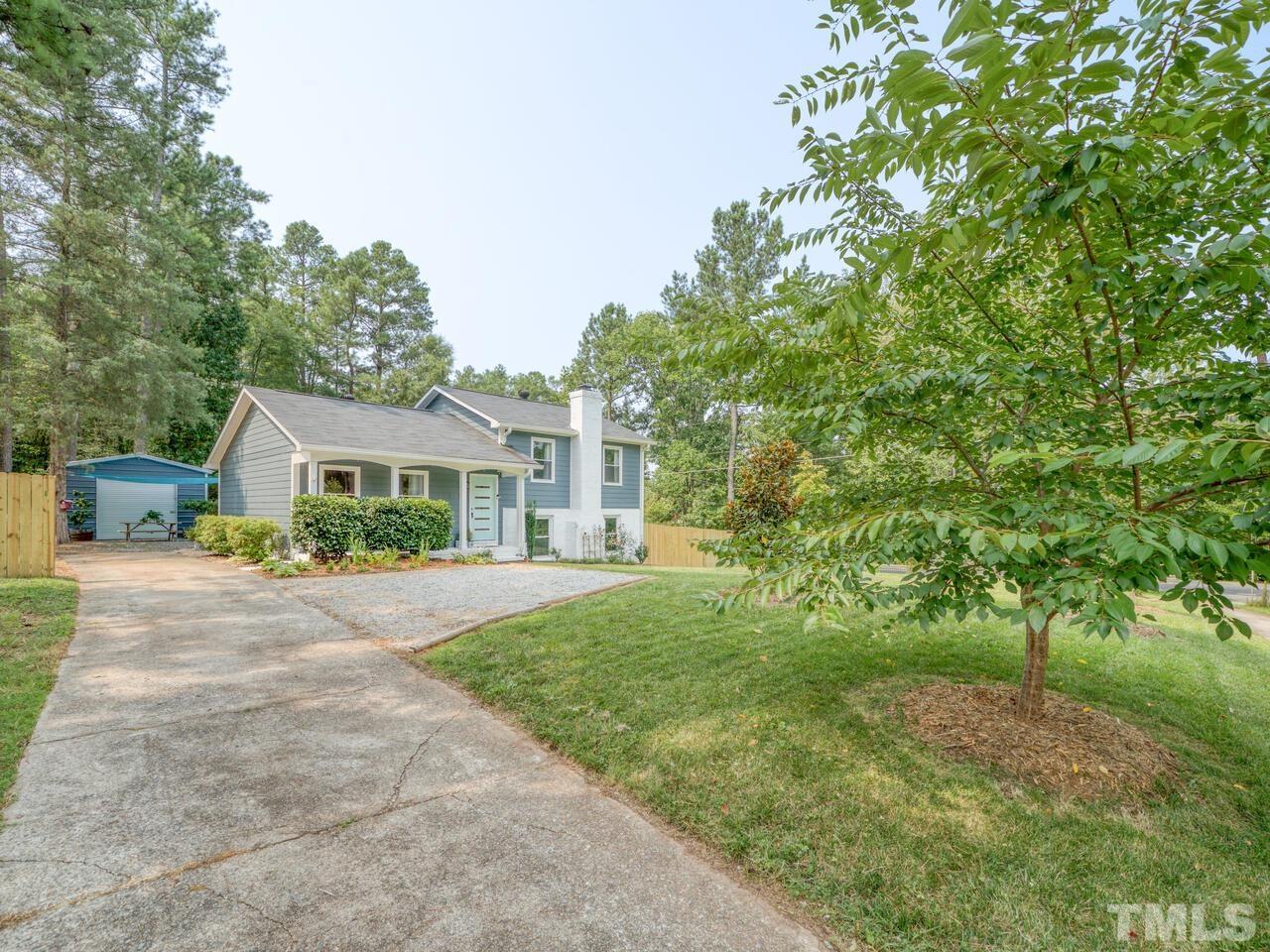 1300 Clermont Road Durham, NC 27713 - Photo 47 of 50 a front view of a house with a yard and trees