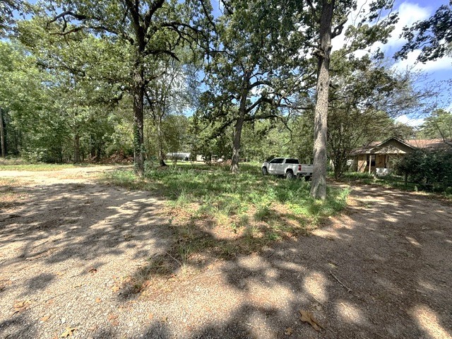 58 Roy Webb Road Huntsville, TX 77320 - Photo 2 of 31 Circle driveway as you enter the property at the brick home.