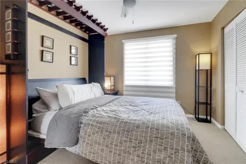 a bathroom with a sink vanity mirror and toilet