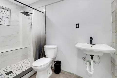 a view of a kitchen with a sink and cabinet
