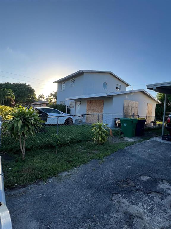 758 Southwest 3rd Place Dania Beach, FL 33004 - Photo 11 of 26 a front view of a house with garden
