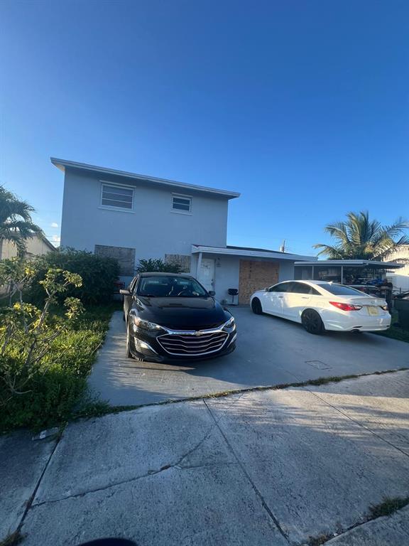 758 Southwest 3rd Place Dania Beach, FL 33004 - Photo 18 of 26 a car parked in front of a building