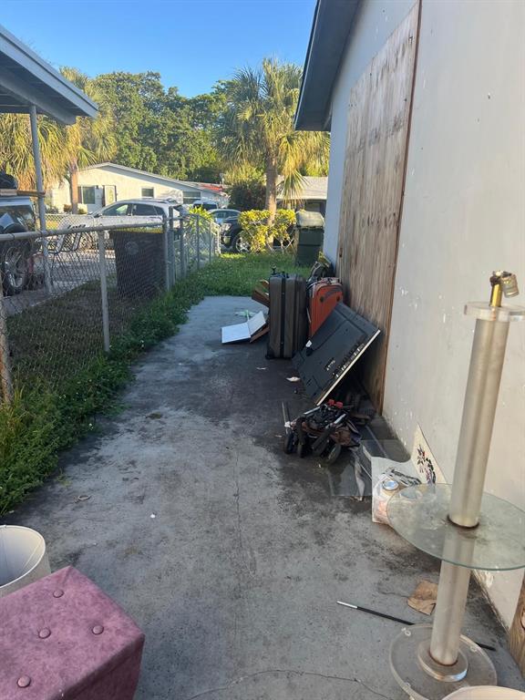 758 Southwest 3rd Place Dania Beach, FL 33004 - Photo 21 of 26 a view of a porch with furniture and a yard