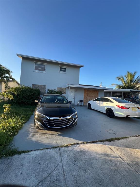 758 Southwest 3rd Place Dania Beach, FL 33004 - Photo 23 of 26 a car parked in front of a house