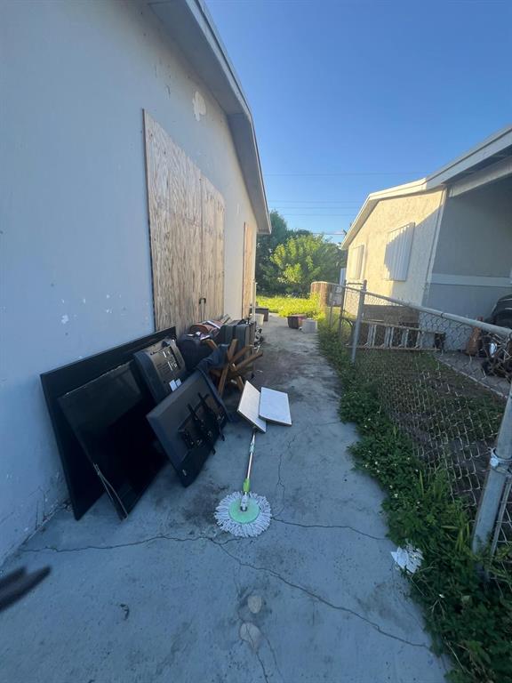 758 Southwest 3rd Place Dania Beach, FL 33004 - Photo 4 of 26 a backyard of a house with table and chairs