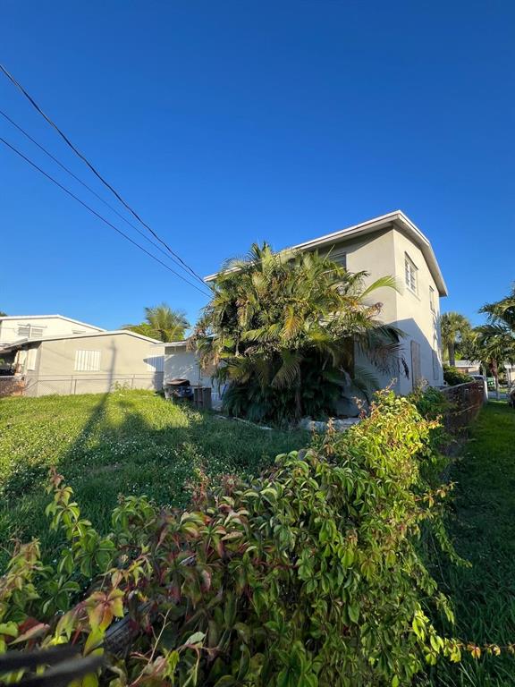 758 Southwest 3rd Place Dania Beach, FL 33004 - Photo 5 of 26 a view of a building with a yard