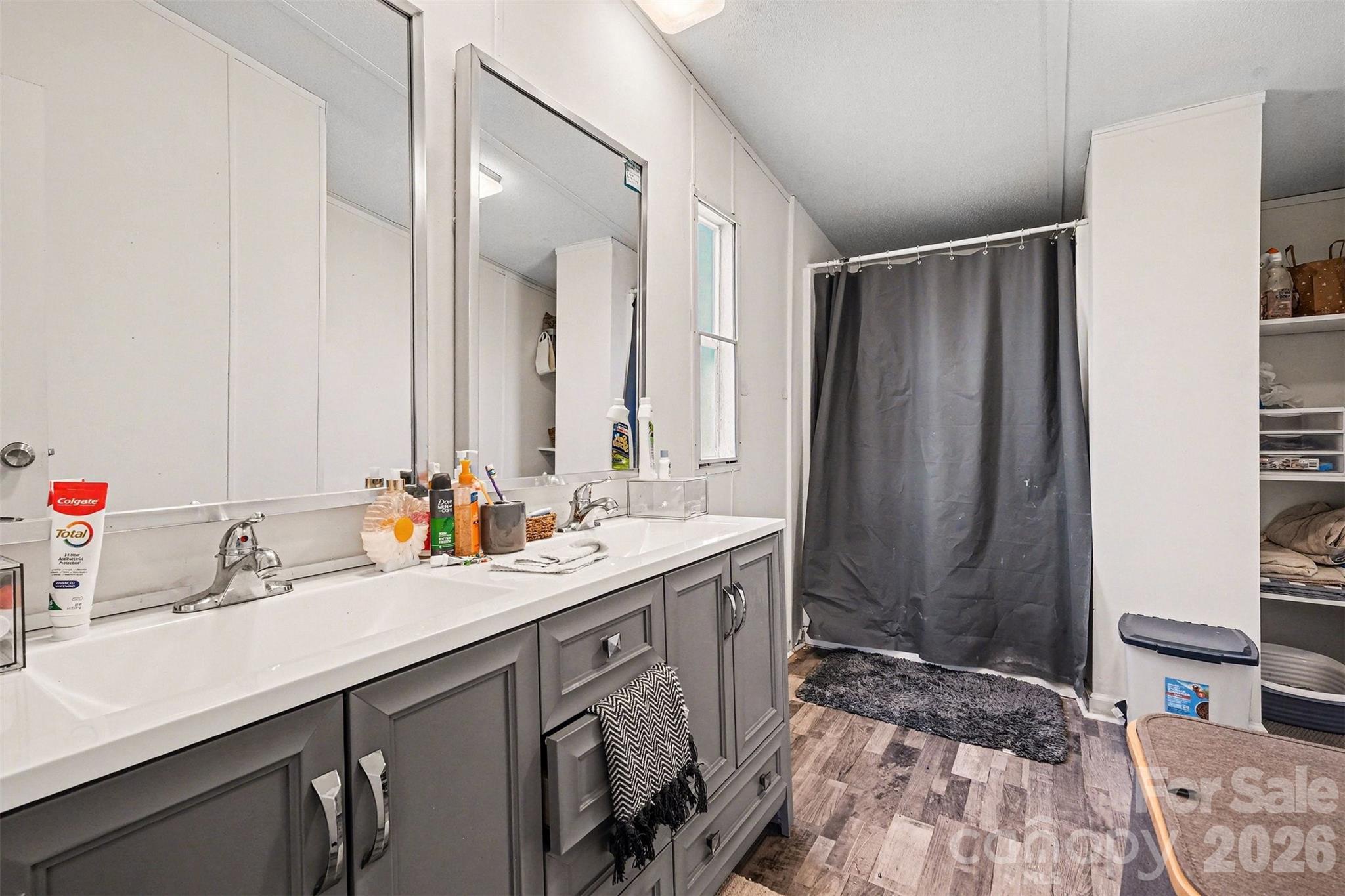 4106 Olga Court Dallas, NC 28034 - Photo 19 of 30 a bathroom with a double vanity sink mirror and double