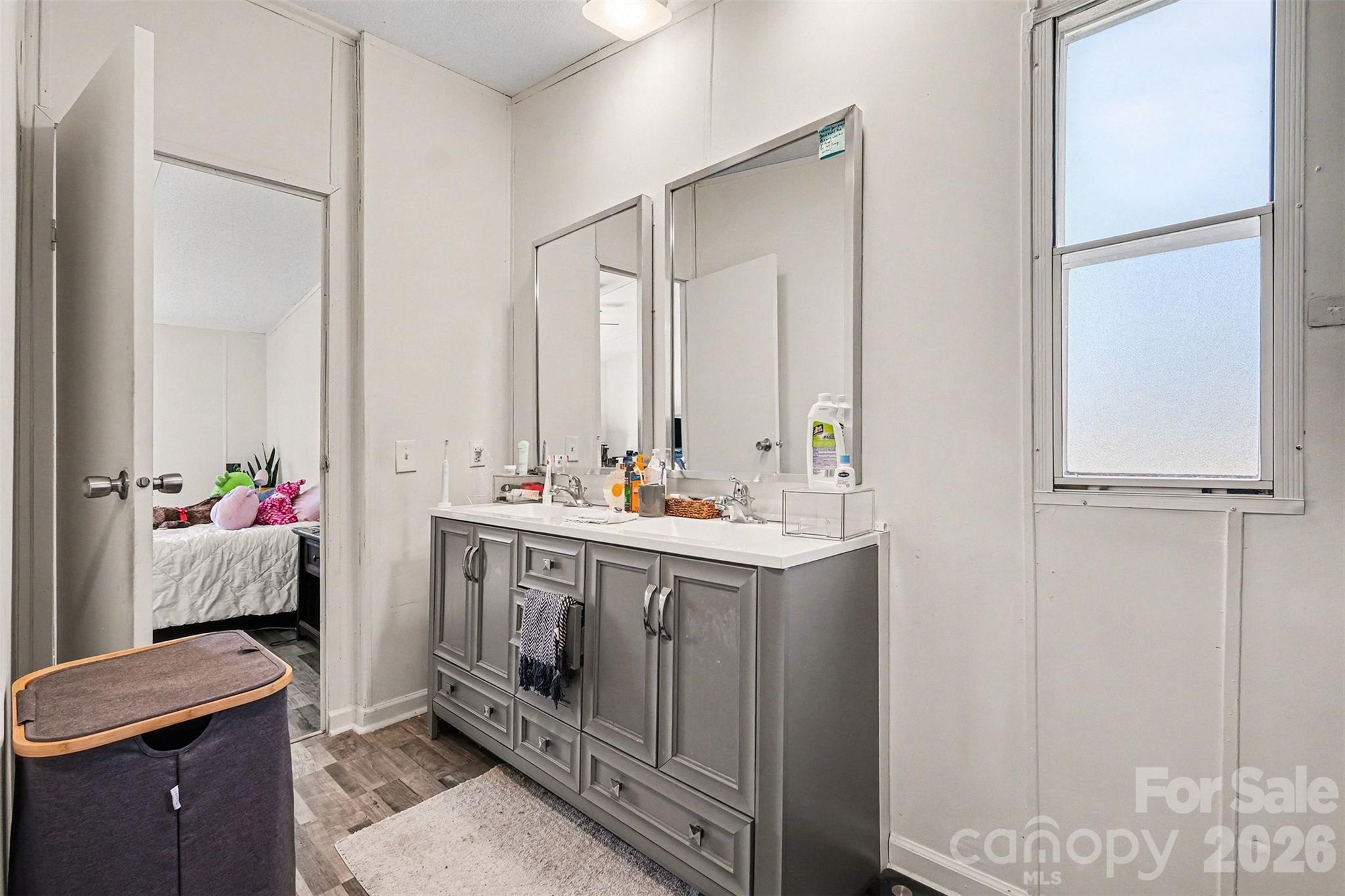 4106 Olga Court Dallas, NC 28034 - Photo 20 of 30 a bathroom with a sink vanity and mirror