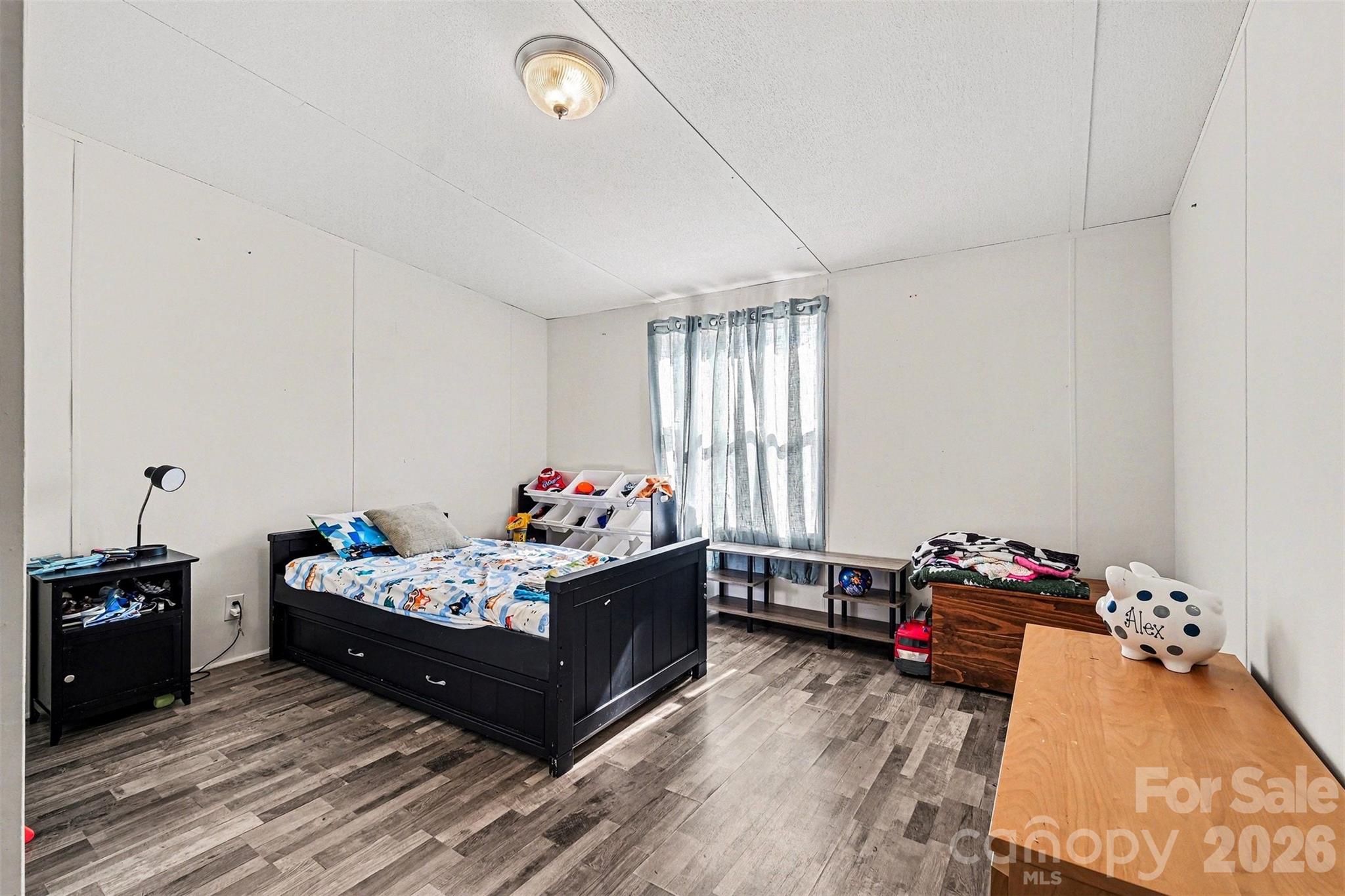 4106 Olga Court Dallas, NC 28034 - Photo 21 of 30 a bed room with furniture and a window