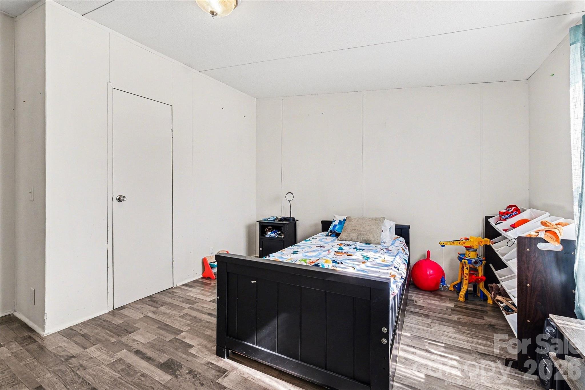 4106 Olga Court Dallas, NC 28034 - Photo 22 of 30 a utility room with toys and wooden floor