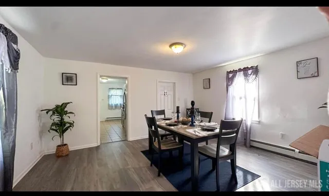 a view of a dining room with furniture and window