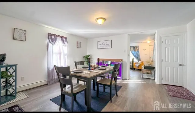 a view of a livingroom with furniture and a window