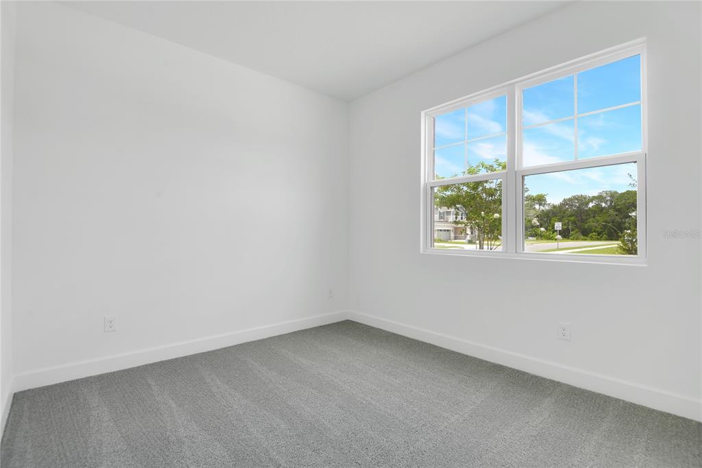3723 Malad Way Tavares, FL 32778 - Photo 11 of 24 an empty room with a window