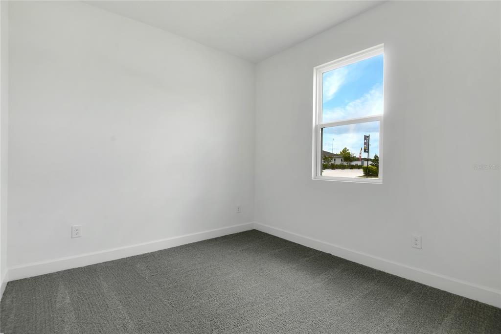 3723 Malad Way Tavares, FL 32778 - Photo 13 of 24 an empty room with a window