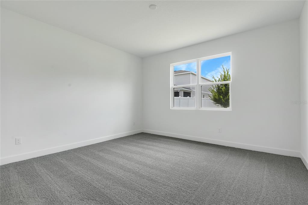 3723 Malad Way Tavares, FL 32778 - Photo 14 of 24 an empty room with a window