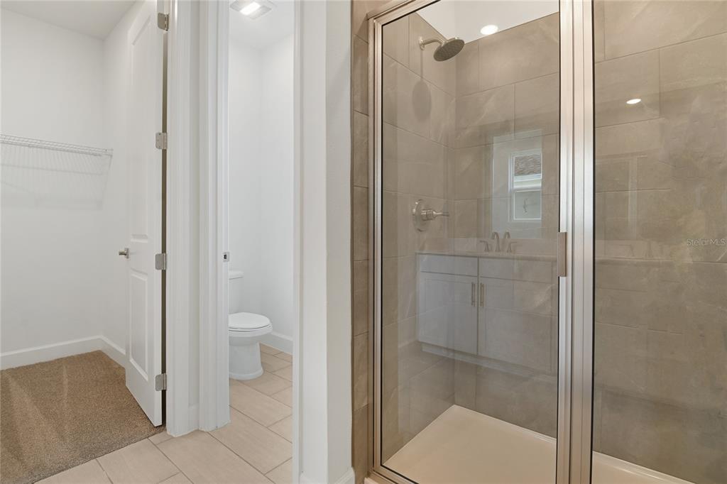 3723 Malad Way Tavares, FL 32778 - Photo 16 of 24 a bathroom with a granite countertop shower