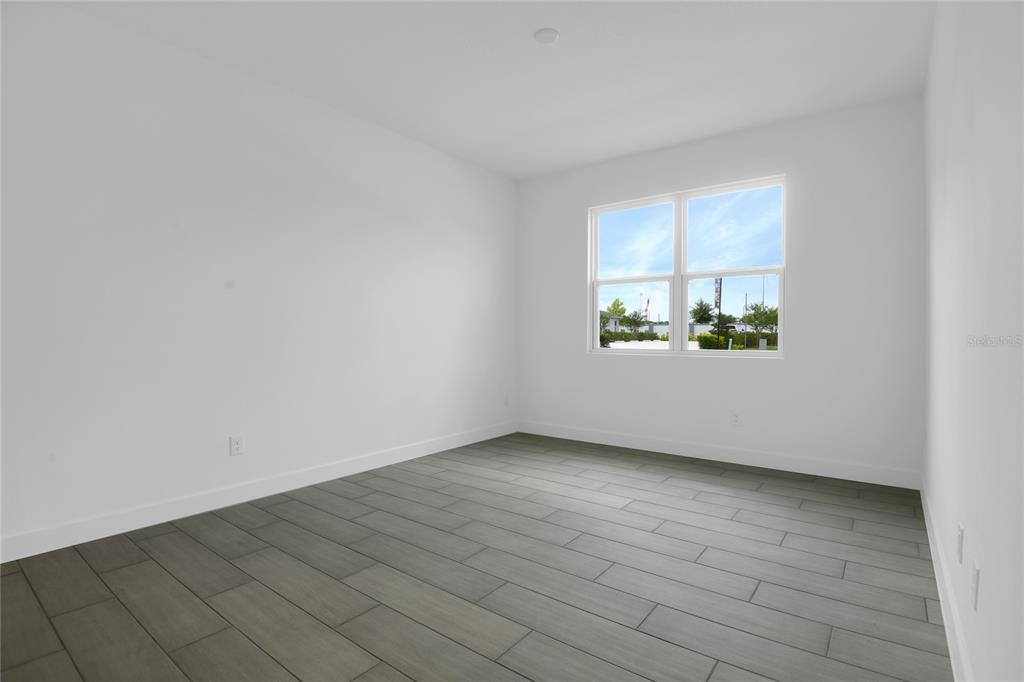 3723 Malad Way Tavares, FL 32778 - Photo 17 of 24 an empty room with a window