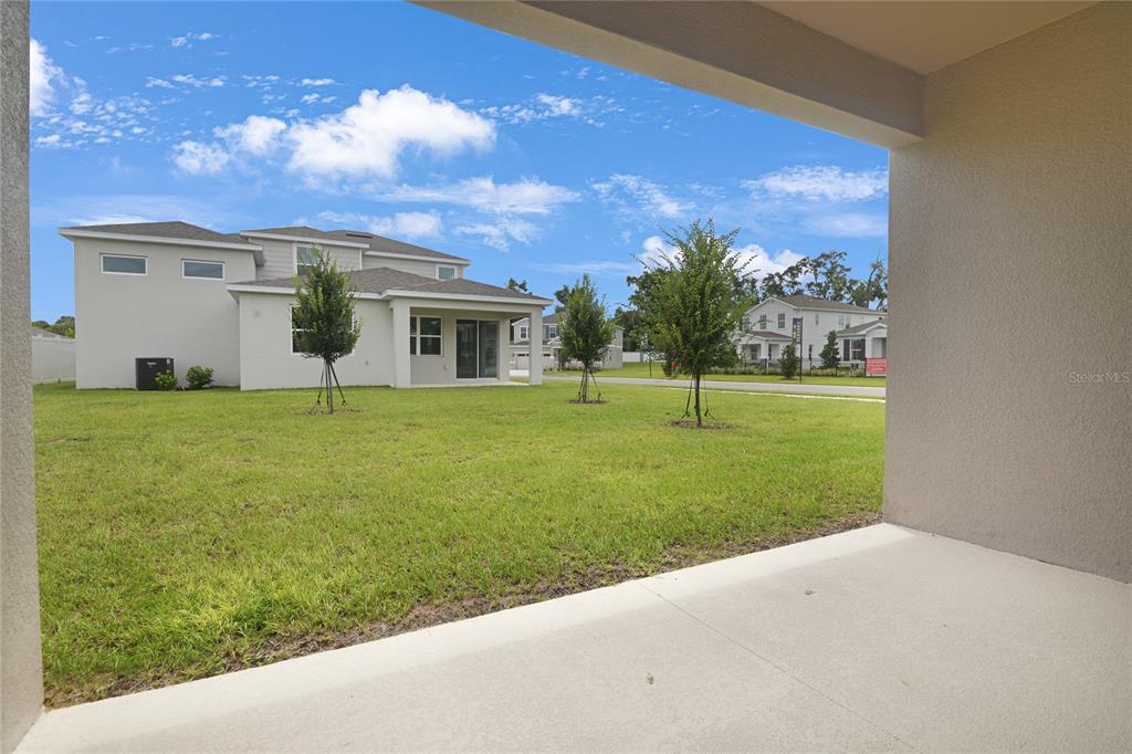 3723 Malad Way Tavares, FL 32778 - Photo 19 of 24 a view of a house with a yard