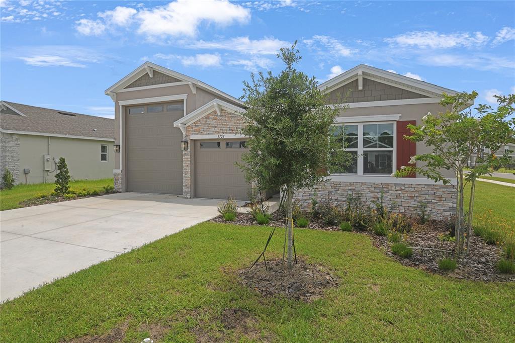3723 Malad Way Tavares, FL 32778 - Photo 3 of 24 a view of a house with a yard