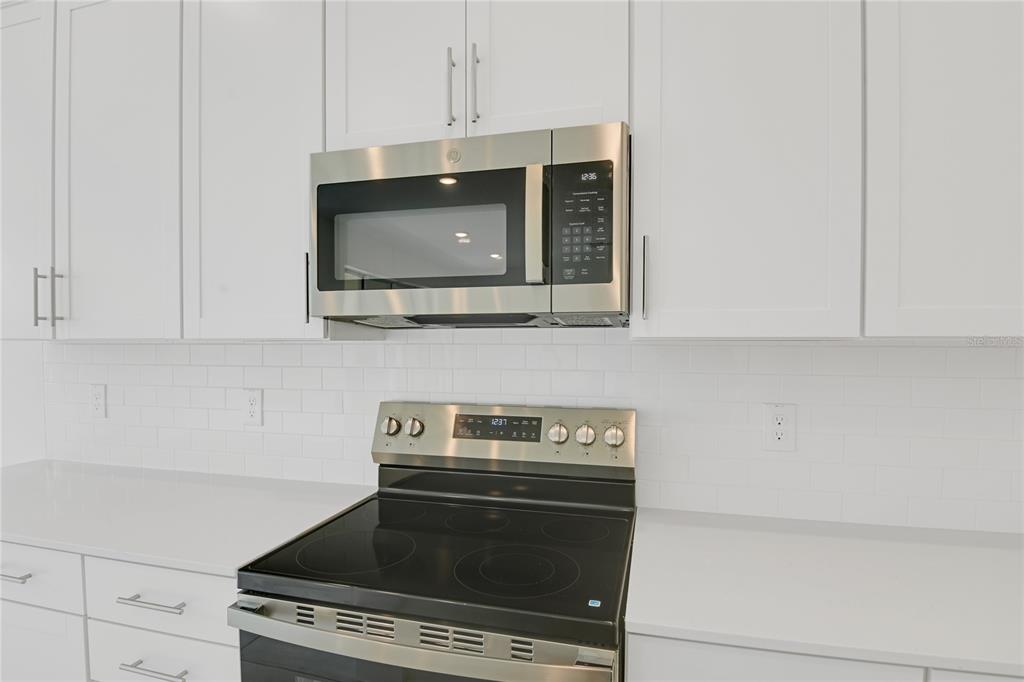 3723 Malad Way Tavares, FL 32778 - Photo 7 of 24 a stove top oven sitting inside of a kitchen