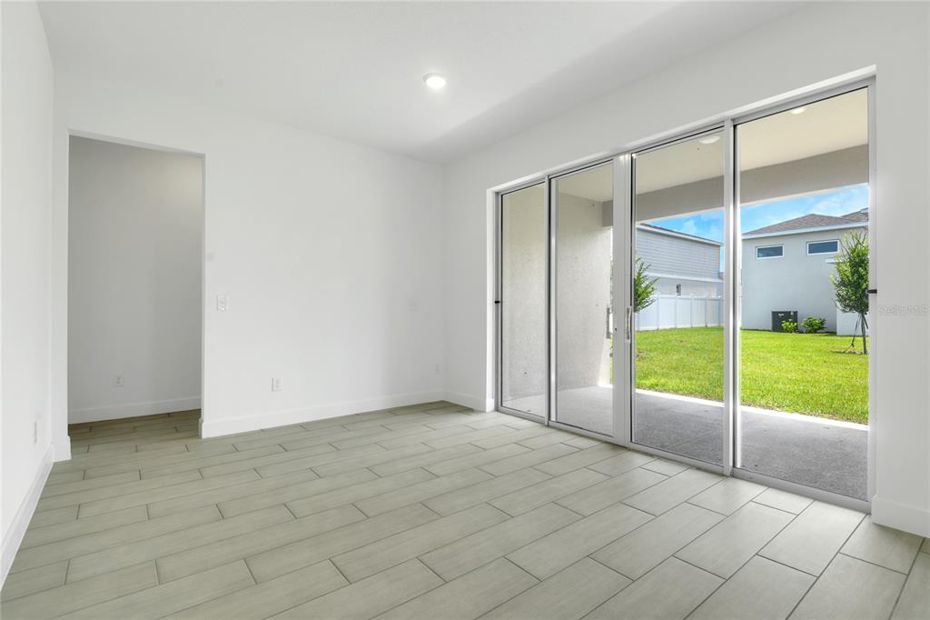 3723 Malad Way Tavares, FL 32778 - Photo 9 of 24 a view of an empty room with window