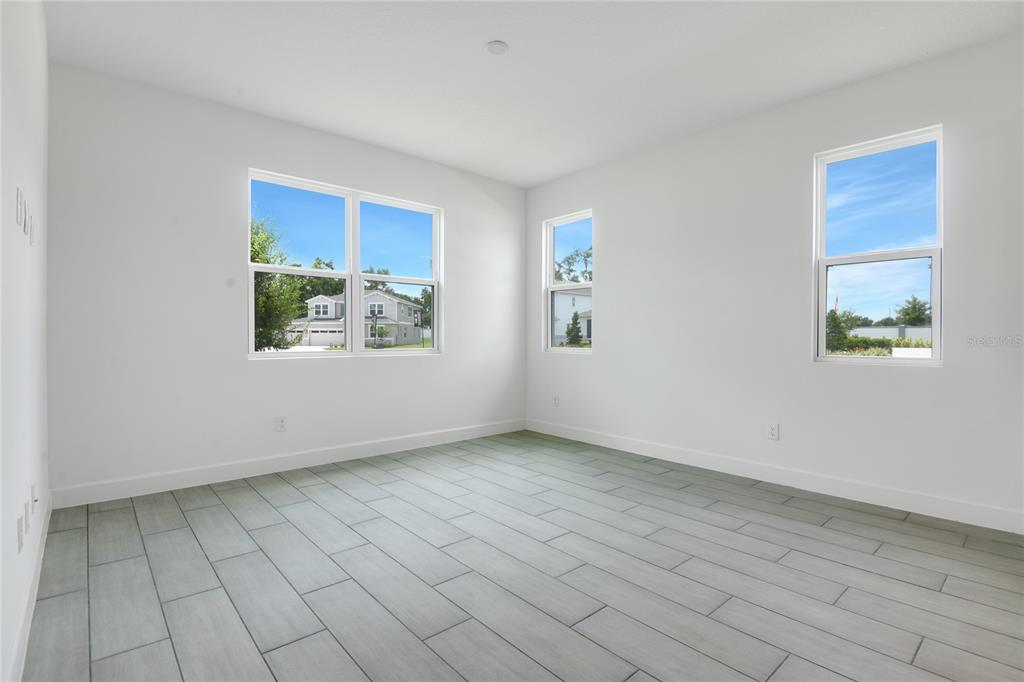 3723 Malad Way Tavares, FL 32778 - Photo 10 of 24 a view of an empty room with a window