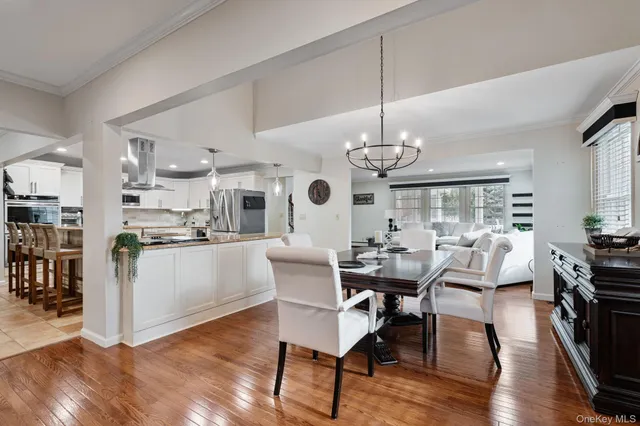 a kitchen with stainless steel appliances granite countertop a refrigerator sink and cabinets