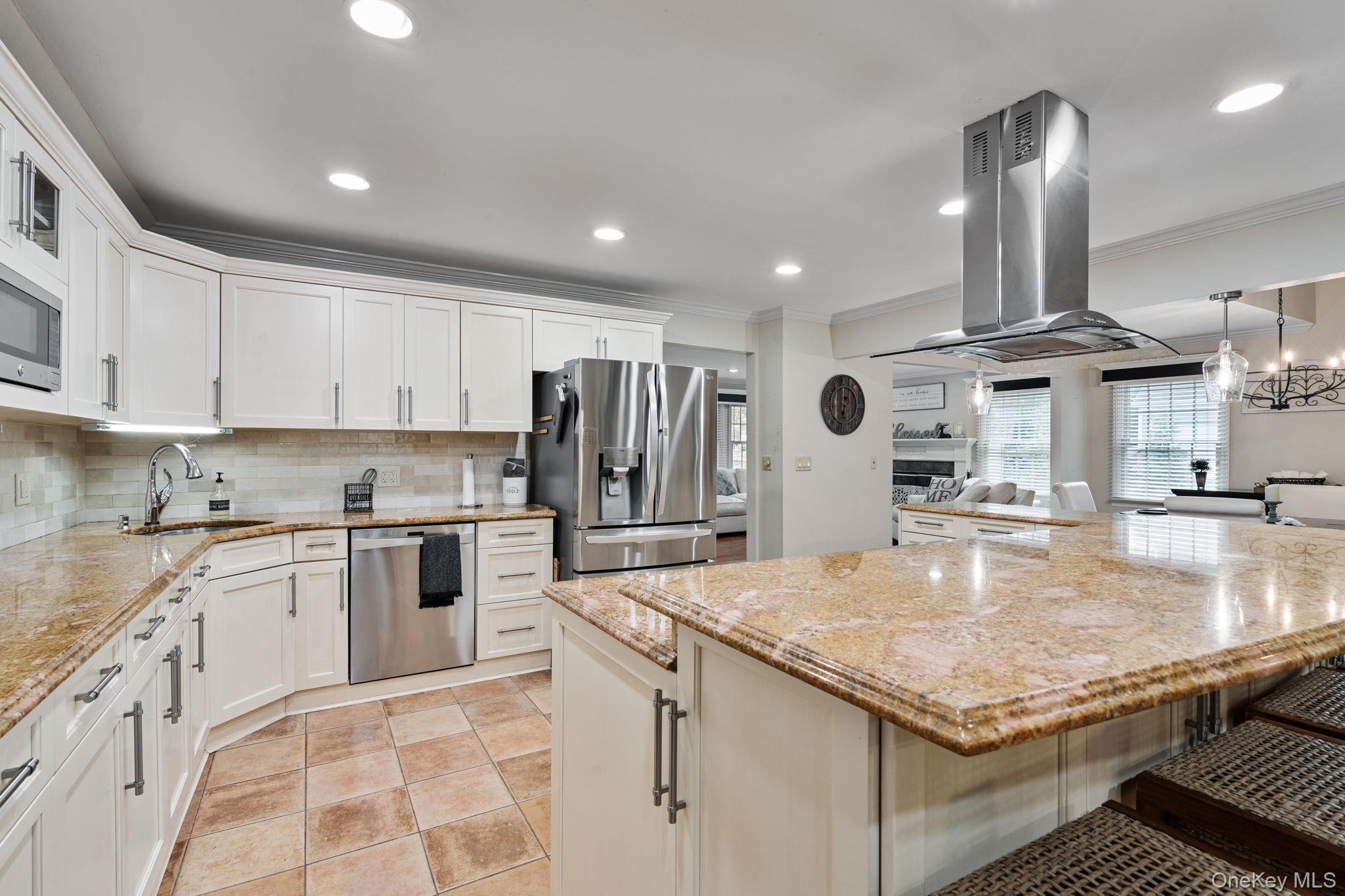 6 Daniel Way Setauket, NY 11733 - Photo 14 of 41 a kitchen with stainless steel appliances granite countertop a sink stove and refrigerator