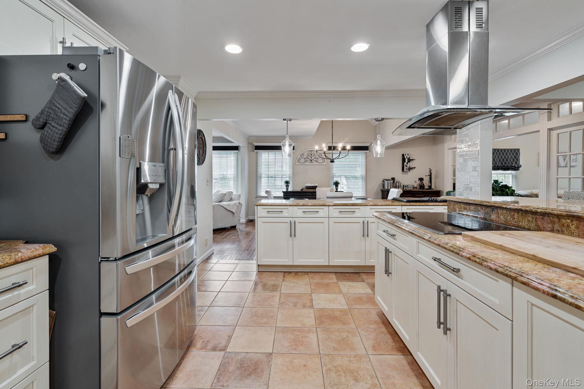 6 Daniel Way Setauket, NY 11733 - Photo 16 of 41 a kitchen with stainless steel appliances granite countertop a refrigerator and a sink