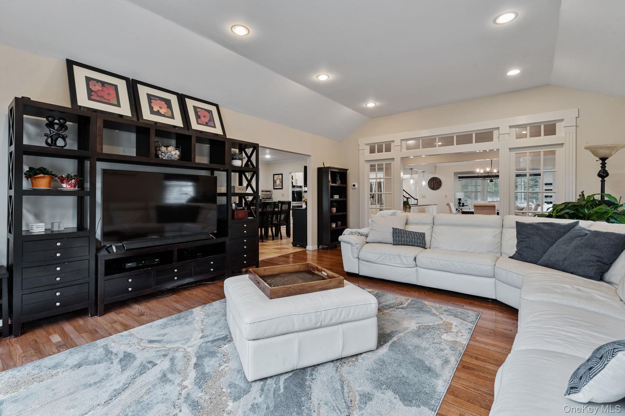 6 Daniel Way Setauket, NY 11733 - Photo 23 of 41 a living room with furniture and a flat screen tv