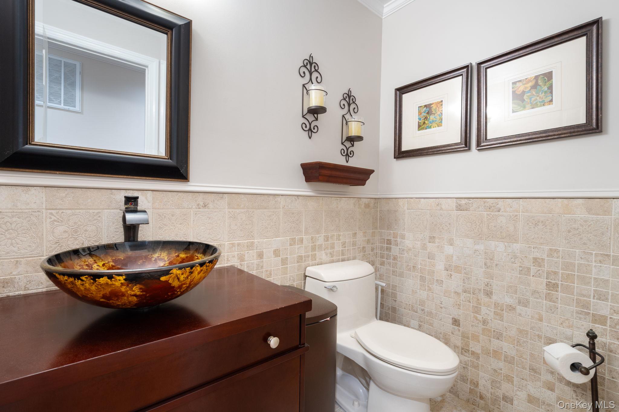6 Daniel Way Setauket, NY 11733 - Photo 24 of 41 a bathroom with a toilet a sink and mirror