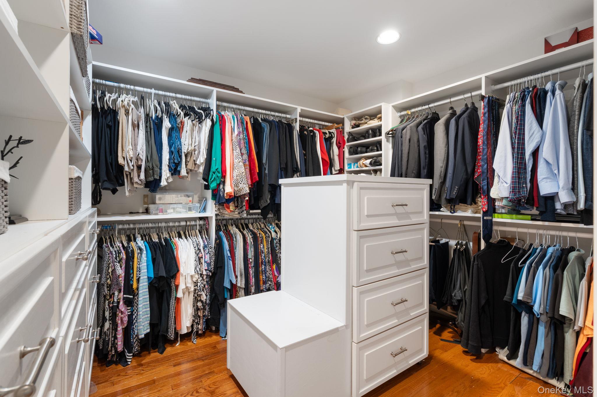 6 Daniel Way Setauket, NY 11733 - Photo 28 of 41 a view of walk in closet with clothes and shoes