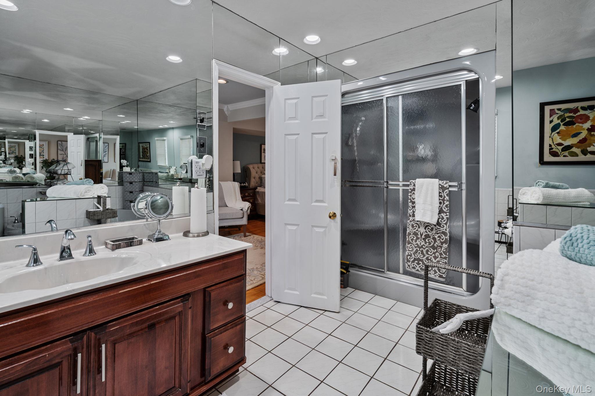 6 Daniel Way Setauket, NY 11733 - Photo 30 of 41 Ensuite bathroom with vanity, light tile patterned floors, a stall shower, and recessed lighting