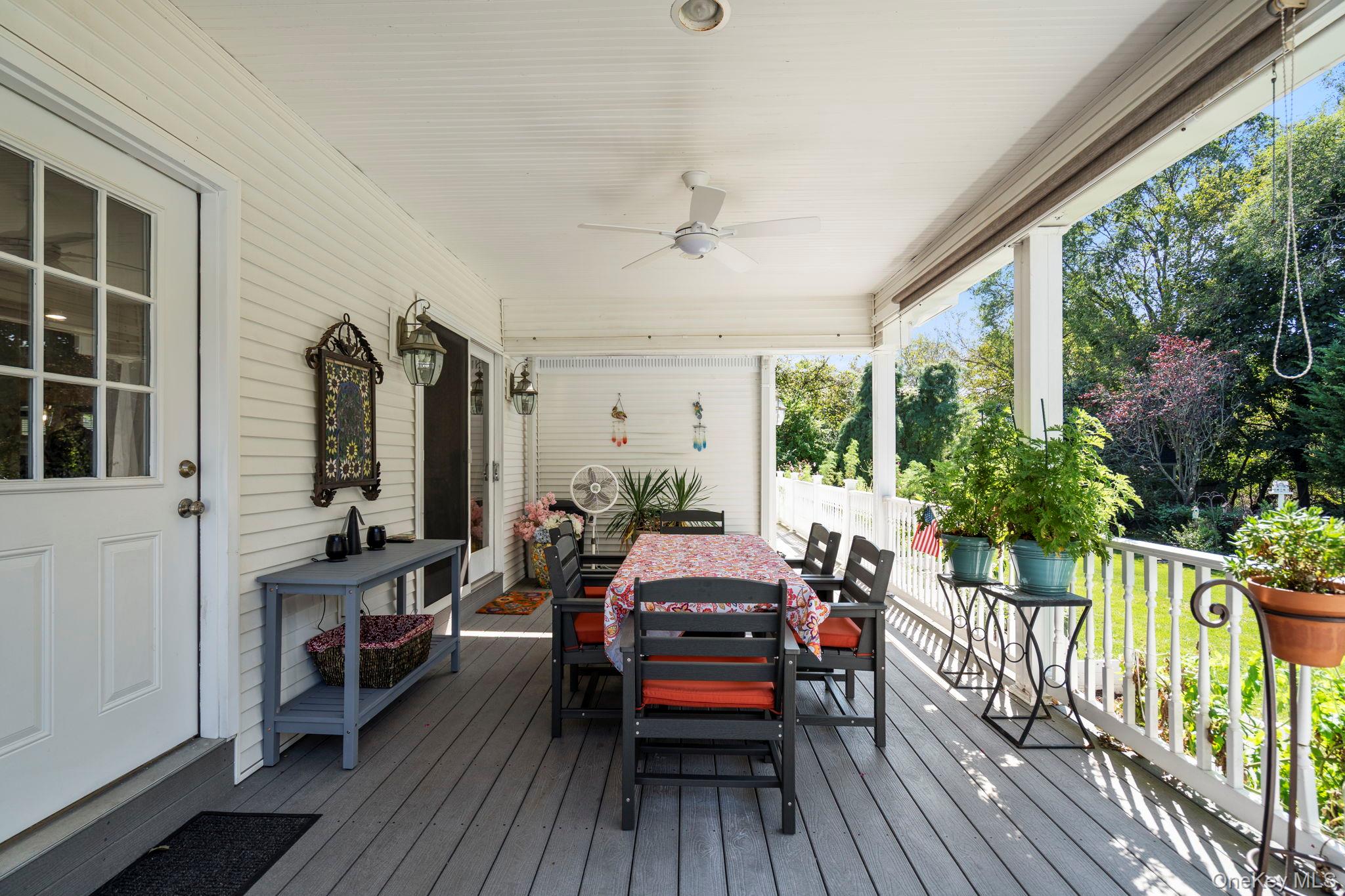 6 Daniel Way Setauket, NY 11733 - Photo 39 of 41 Wooden terrace featuring a ceiling fan